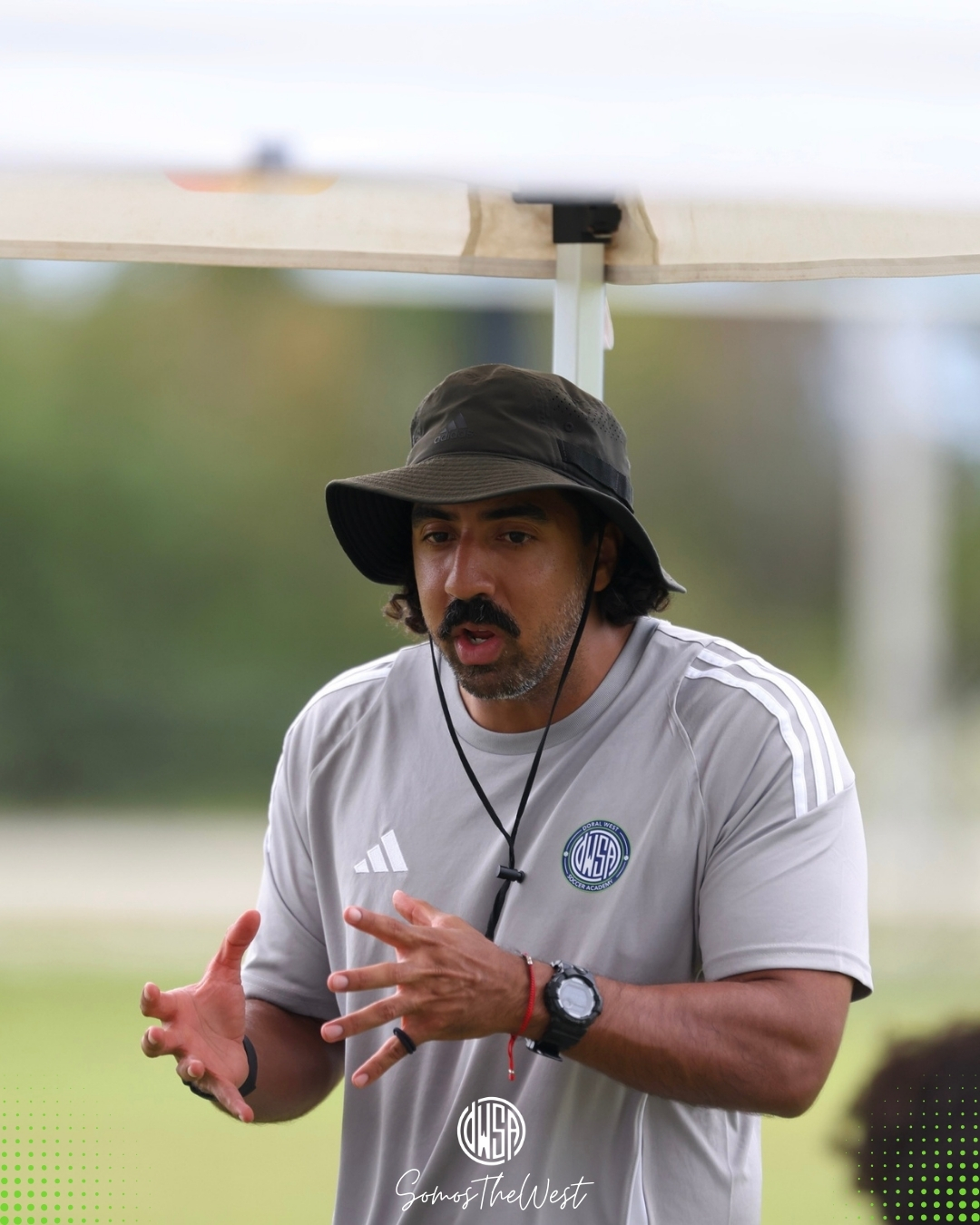 Ricardo D. Cuenca coaching from the sideline