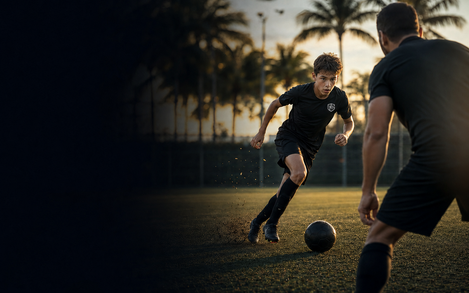 Youth soccer player training one-on-one with a coach